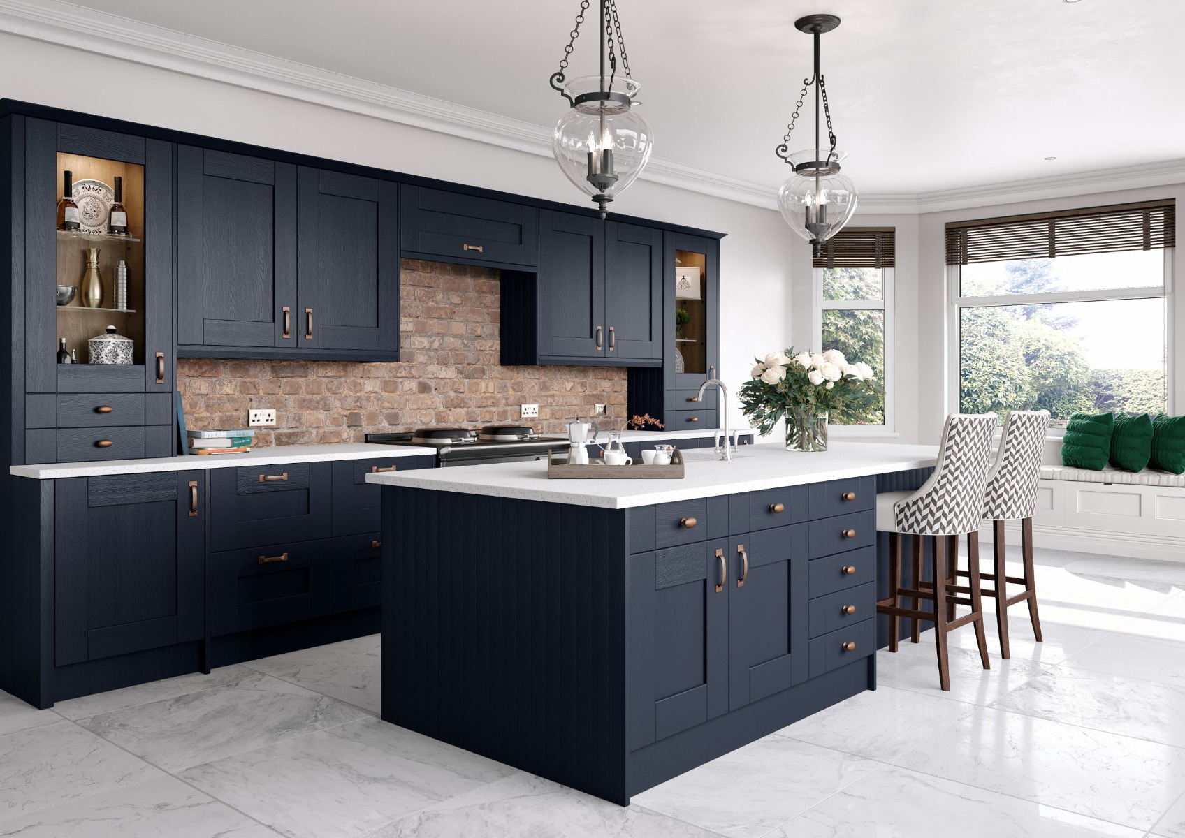The Cartmel kitchen in indigo — a deep navy shaker with a large island and warm lighting